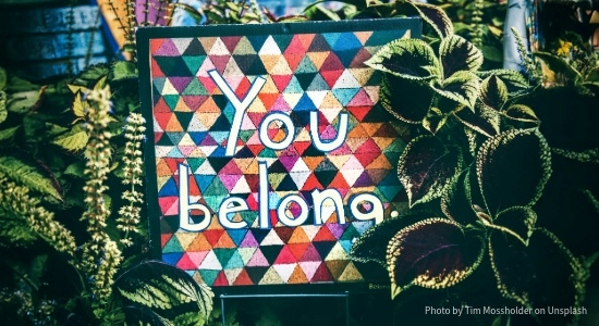 you belong written on a sign that looks like a quilt